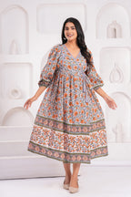 Woman wearing a floral dress against a white background